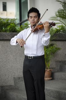 Thailand asia man with his violin he is a soloist