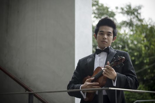 Thailand asia man with his violin he is a soloist