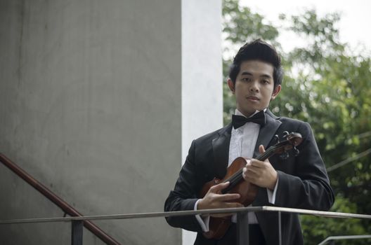 Thailand asia man with his violin he is a soloist