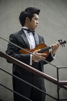 Thailand asia man with his violin he is a soloist