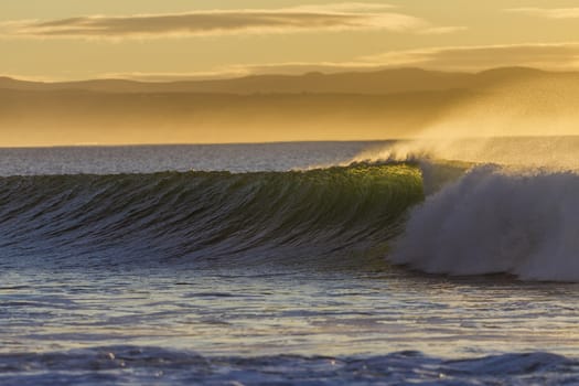 Clean crisp morning ocean wave breaking or crashing onto shallow reef shoreline 







Clean ocean wave breaking or crashing on reef early morning