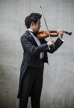 Thailand asia man with his violin he is a soloist