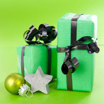 Christmas presents in green on a white background