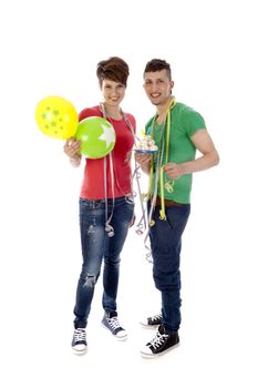 a boy and a girl with balloons and a birthdaycake