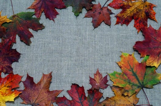 Background of autumn leaves on fabric