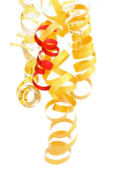Arrangement of Yellow, Striped and One Red Hanging Curly Party Streamers isolated on white background