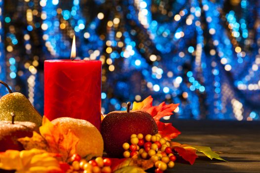 Candles in nice and beautiful colorful autumn leaves