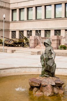 Statue of a stanging dwarf in the fountain
