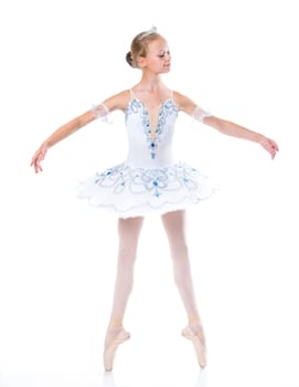 Beautiful young ballerina in classical tutu on a white background
