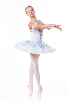 Beautiful young ballerina in classical tutu on a white background