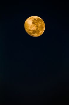 Full moon reflecting color in detail