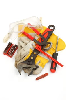 Close up of bunch of hand tools on a white background
