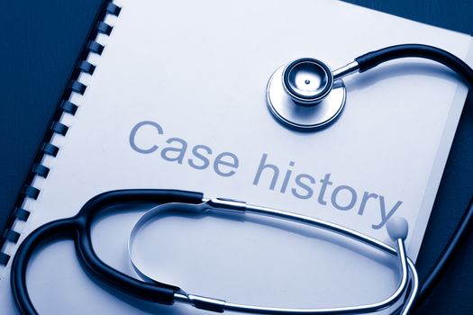 Case history and stethoscope on black