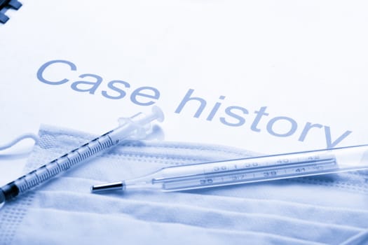 Case history, mask, syringe and thermometer
