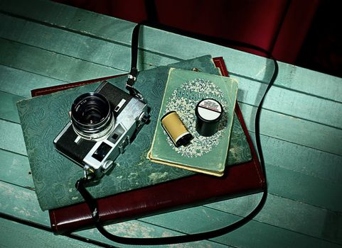 Vintage camera with old photo album, Still life