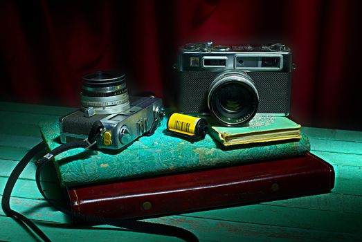 Vintage camera with old photo album, Still life