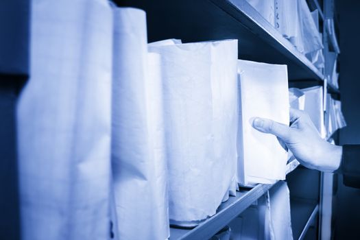 Paper documents stacked in archive