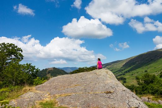 Female young hiker overlooking Thirlmere in English Lake District in Lakeland Cumbria