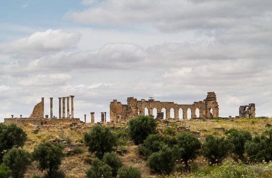 Volubilis is a partly excavated Roman city in Morocco situated near Meknes between Fes and Rabat. Built in a fertile agricultural area, it was developed from the 3rd century BC onwards as a Phoenician Carthaginian settlement