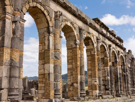 Volubilis is a partly excavated Roman city in Morocco situated near Meknes between Fes and Rabat. Built in a fertile agricultural area, it was developed from the 3rd century BC onwards as a Phoenician Carthaginian settlement