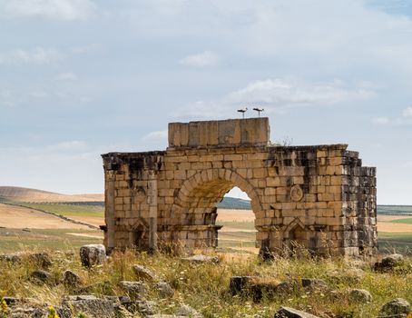 Volubilis is a partly excavated Roman city in Morocco situated near Meknes between Fes and Rabat. Built in a fertile agricultural area, it was developed from the 3rd century BC onwards as a Phoenician Carthaginian settlement