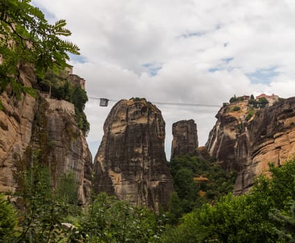 Cable car between monasteries at Meteora meaning middle of the sky, suspended in the air or in the heavens above is one of the largest and most important complexes of Eastern Orthodox monasteries in Greece. The six monasteries are built on natural sandstone rock pillars