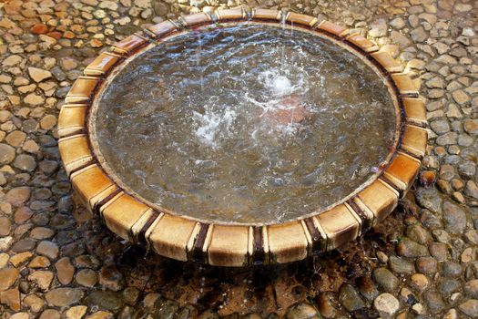 Fountain detail. Palm garden park in Alicante, Spain.