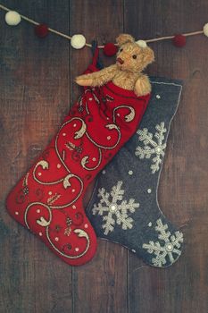 Small teddy bear in stocking for Christmas