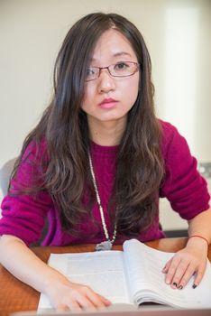 Woman studying with a book