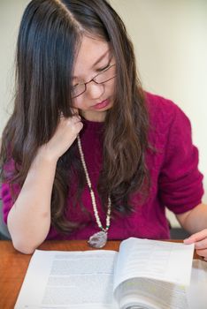 Woman studying with a book