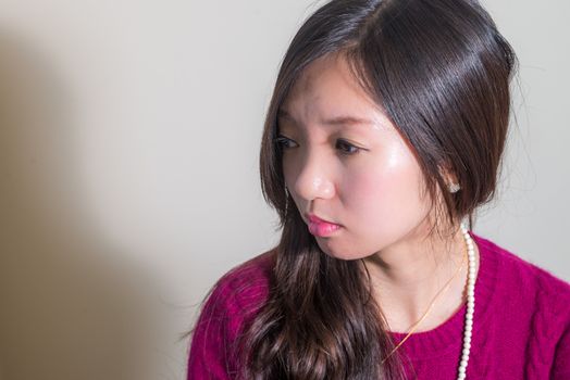 Portrait of young woman looking stressed out