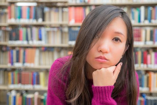 Close portrait of young woman in library