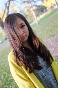 Portrait of young woman with hair covering her face