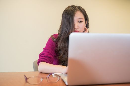 Young woman working and studying on a laptop