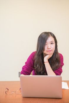 Young woman working and studying on a laptop