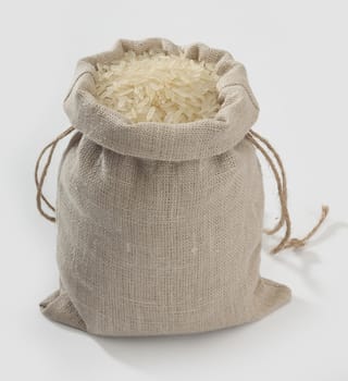 Sack with rice on the grey background