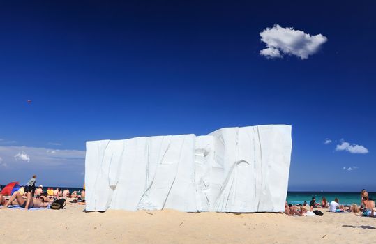 Bondi - Tamarama, Australia - November 9,  2013: Sculpture By The Sea, 2013. Annual cultural event that showcases artists from around the world  Exhibit titled 'Berg ' by Warnockwise (VIC).  Medium -  epoxy hardcoat, polyurethane topcoat, polystyrene foam, steel frame  $18000