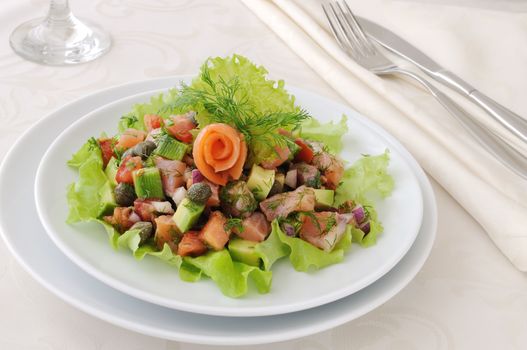 Avocado salad with tomatoes, smoked salmon and capers