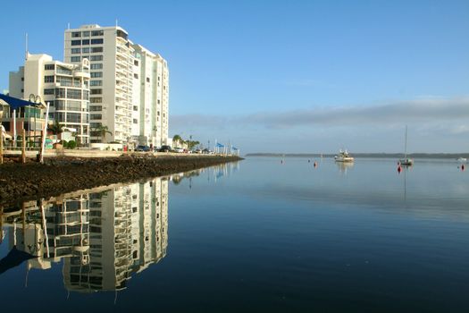 Holiday apartment tower waterside in the early morning.