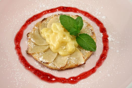 Apple galettes with custard and strawberry conserve.