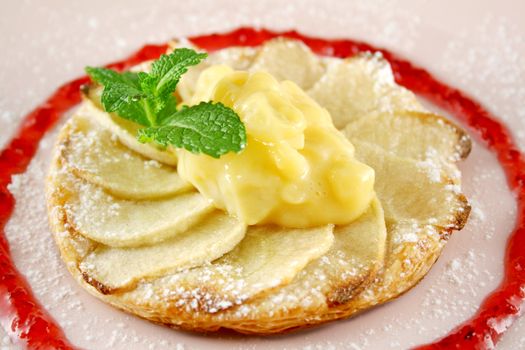 Apple galettes with custard and strawberry conserve.