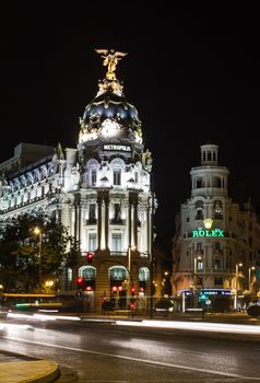 MADRID, SPAIN - SEPTEMBER 2: View of famous Metropolis building in Gran Via street at night, in Madrid, Spain, on September 2, 2013