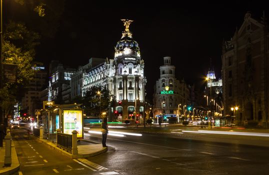 MADRID, SPAIN - SEPTEMBER 2: View of famous Metropolis building in Gran Via street at night, in Madrid, Spain, on September 2, 2013