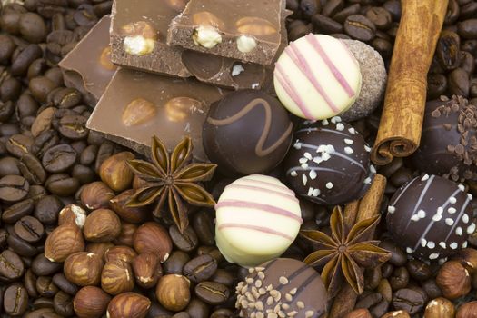 background with chocolate, coffee, spices and nuts