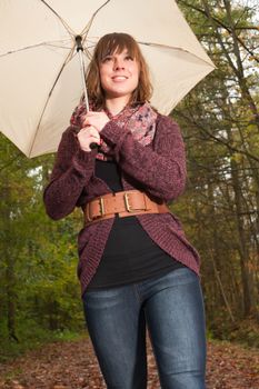 Young woman in the autumn at a cold november day