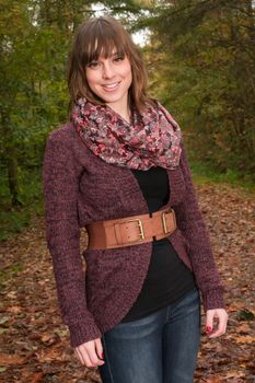 Young woman in the autumn at a cold november day