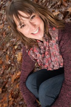 Young woman in the autumn at a cold november day