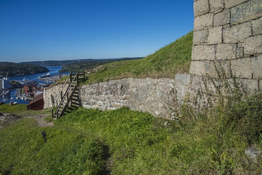 The image is shot in September 2013 at Fredriksten Fortress in Halden, Noway and shows the Large powderhouses and Northern curtain wall that protects the Citadel to the west and connects Queen's bastion with Prince Chritians bastion, the curtain wall was completed in 1668