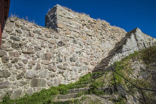 The image is shot in September 2013 at Fredriksten Fortress in Halden, Noway and shows the Large powderhouses and Northern curtain wall that protects the Citadel to the west and connects Queen's bastion with Prince Chritians bastion, the curtain wall was completed in 1668