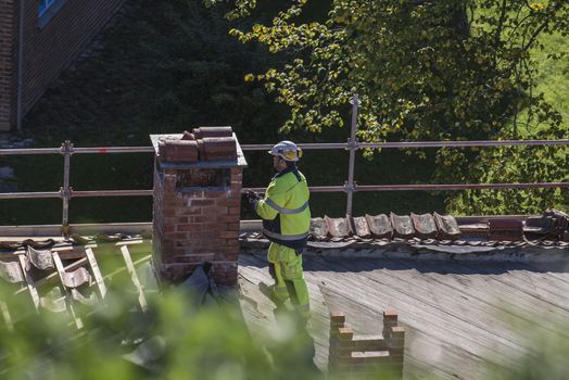 The school building at Fredriksten fortress in Halden, Norway is a major Maintenance work on the roof and new grout on the chimneys. Photo is shot in September 2013.